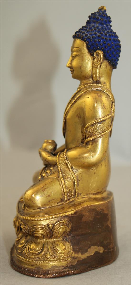 A Sino-Tibetan gilt bronze figure of Sakyamuni Buddha, 15.5cm